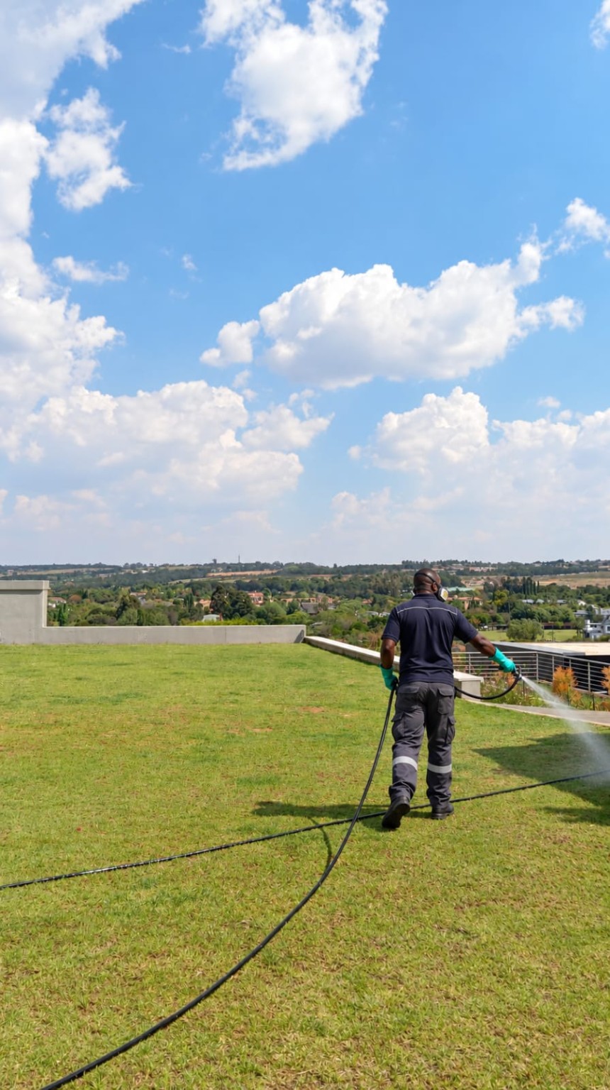 Mr. Weed & Insect technician applying a garden treatment in Mooikloof